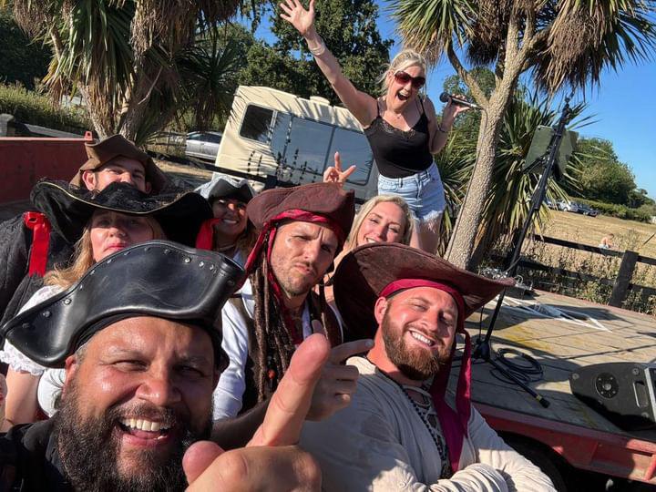 Tracy is posing at a pirate themed event as a Tribute Act Essex