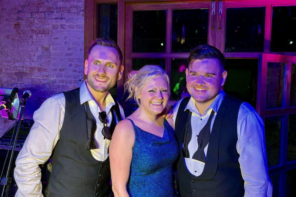 Tracy with grooms at same sex wedding.
